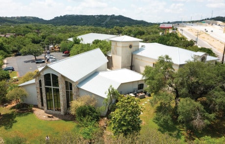 WaterTight Roofing crew installing a weather-resistant roofing system on a religious facility in Texas, ensuring long-lasting protection and structural integrity. Call 888-809-9976 today to partner with WaterTight Roofing for expert commercial roofing solutions tailored to churches and nonprofit buildings across Texas.