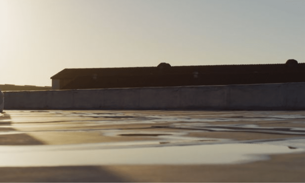 A commercial rooftop with HVAC and solar equipment, showing how proper planning avoids roof damage—contact WaterTight Roofing for a professional site review.