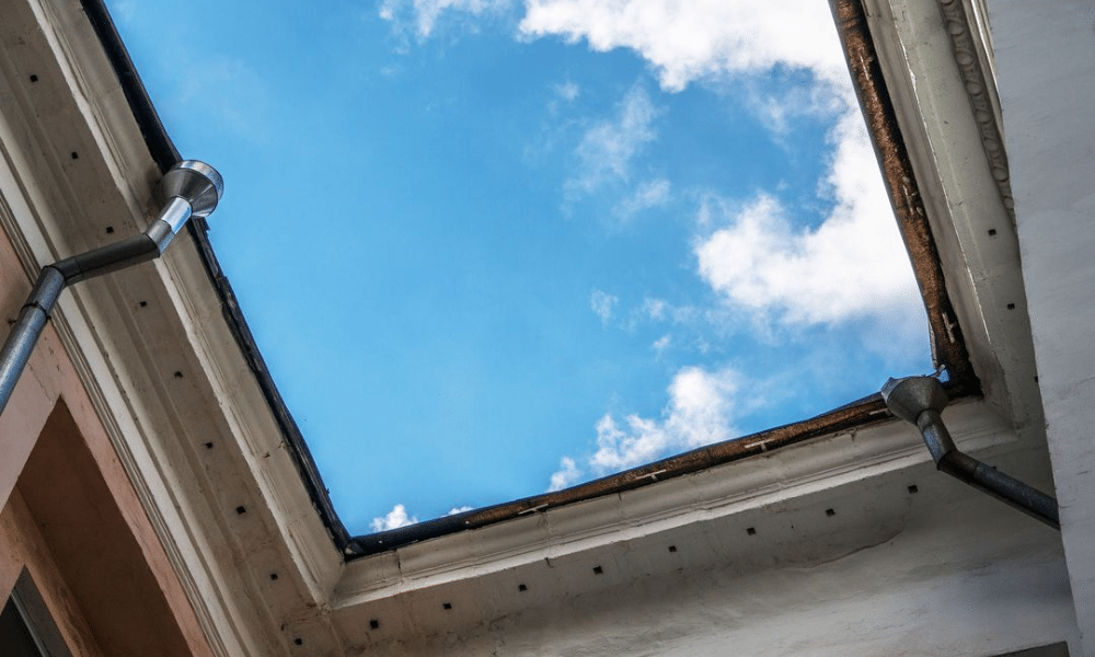 how proper drainage prevents commercial roof damage A flat commercial roof with clearly visible drainage features. Proper drainage keeps water from pooling—helping prevent costly damage. Schedule a drainage inspection today.